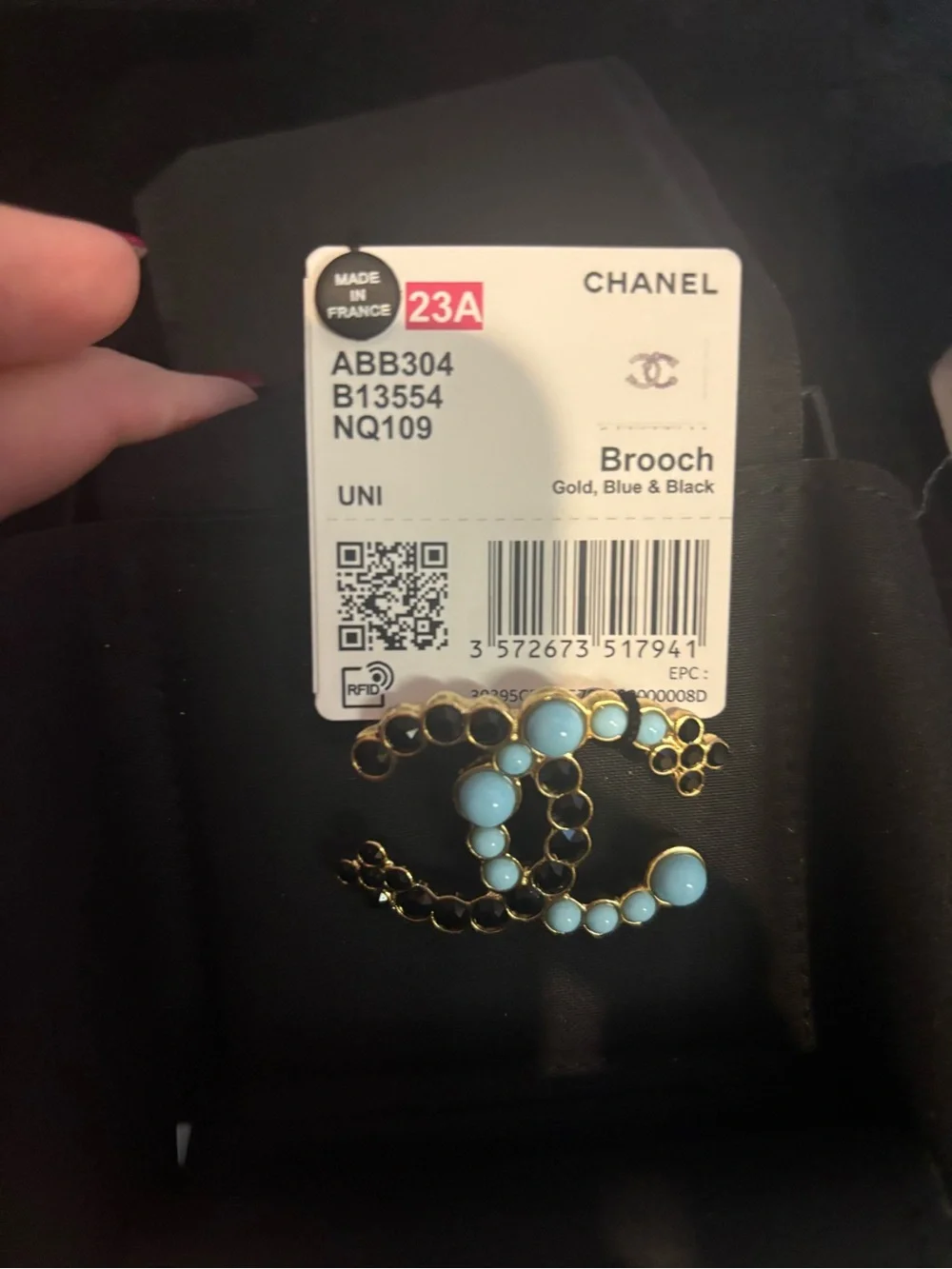 CHANEL Gold Brooch with Light Blue and Black Accents